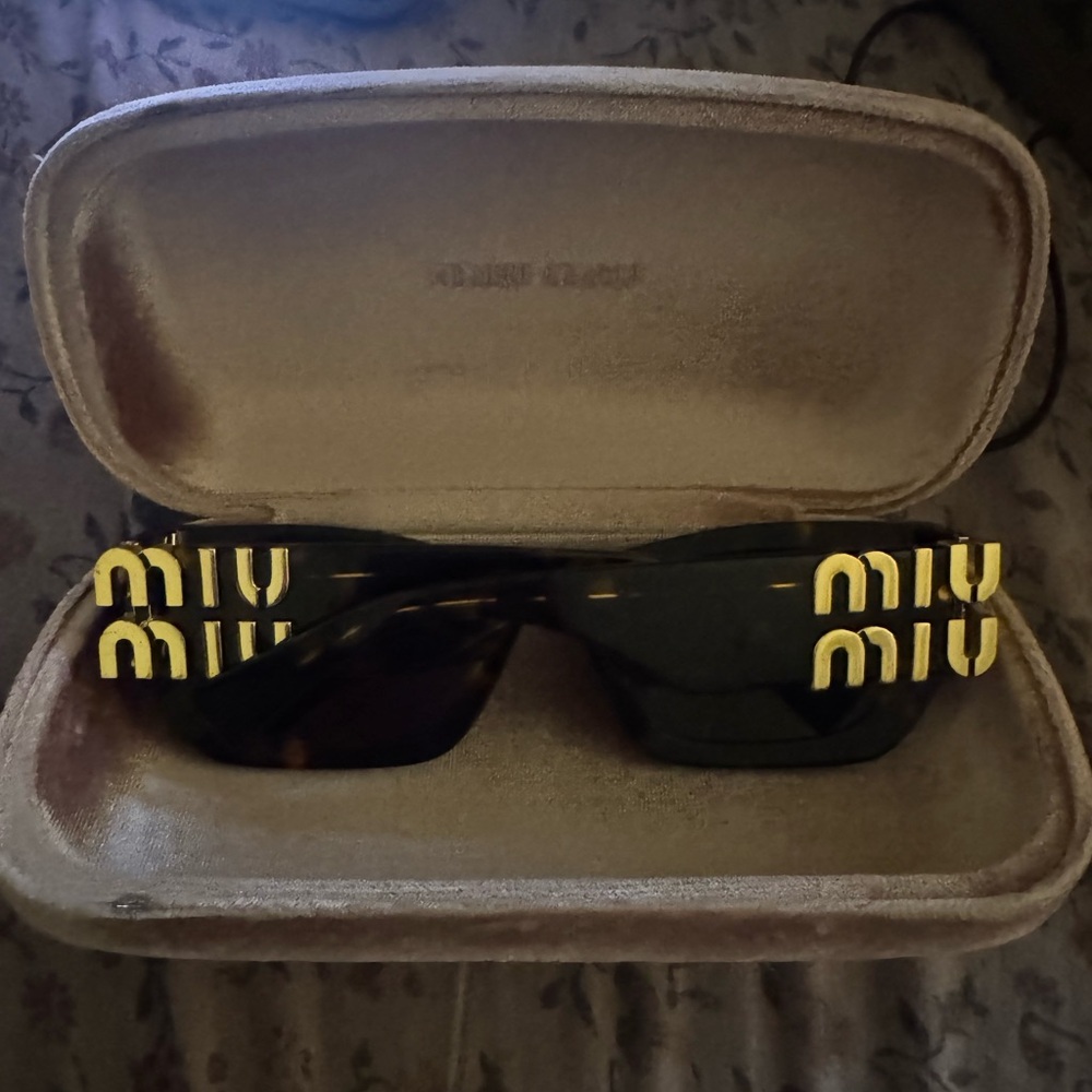 Miu Miu Black Sunglasses with Gold Accents